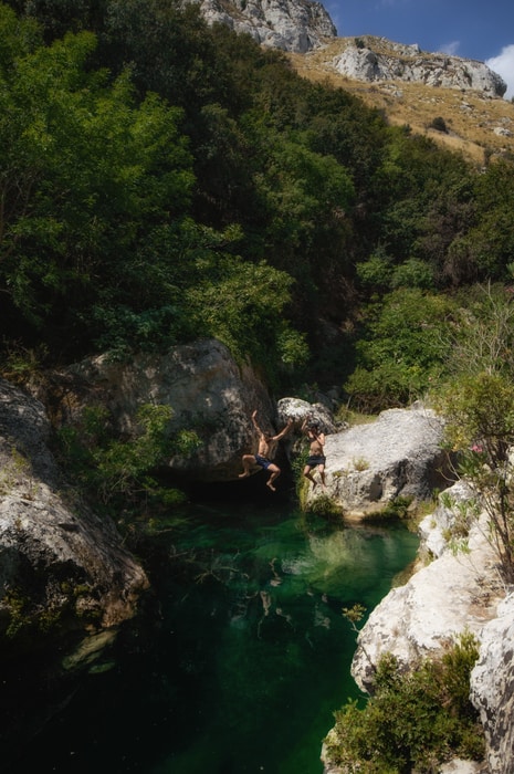 Jumping in the pools of Riserva Naturale Orientata Cavagrande del Cassibile Sicily Italy