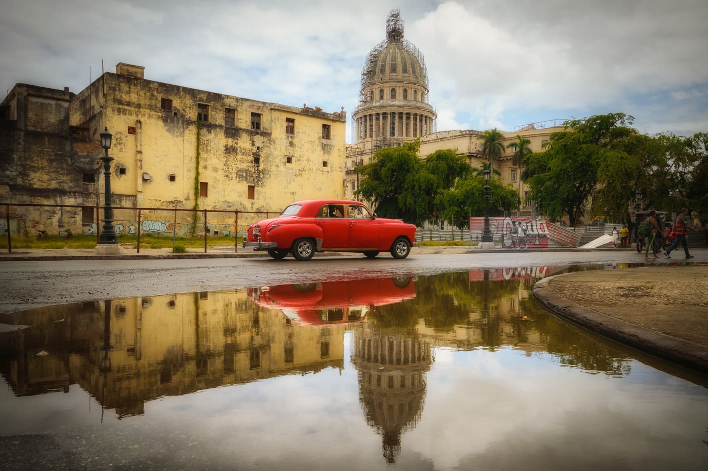 Red car reflection capitolio centro havana