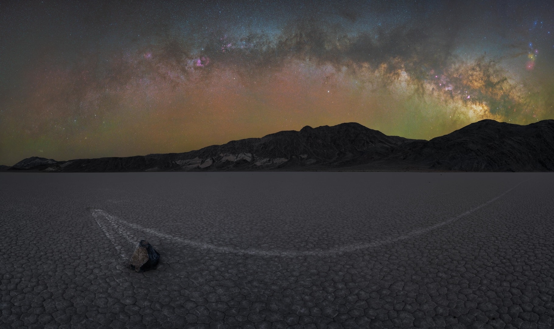 Milky Way arch over a night landscape