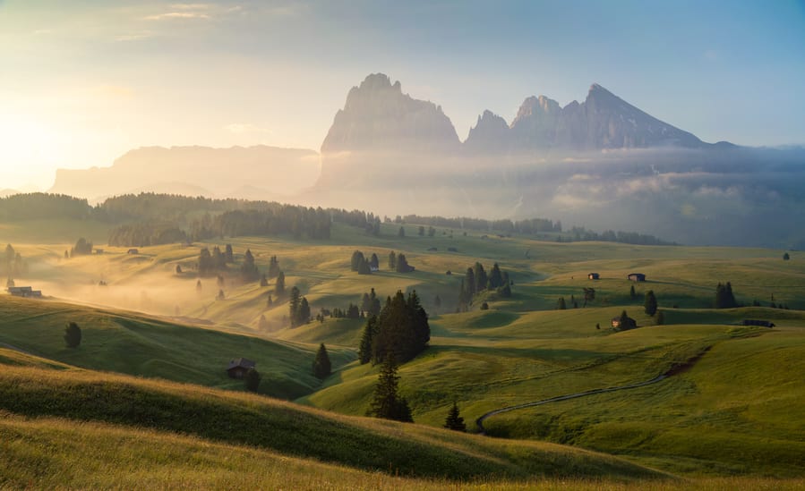 Alpe di Siusi with soft morning light and fog