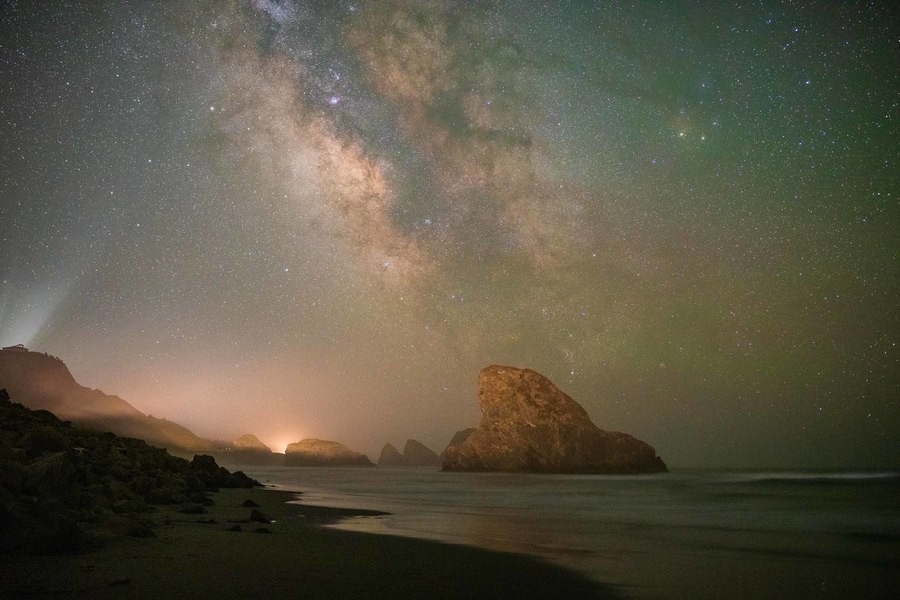 Night scene of the Oregon Coast with sea stacks and the Milky Way