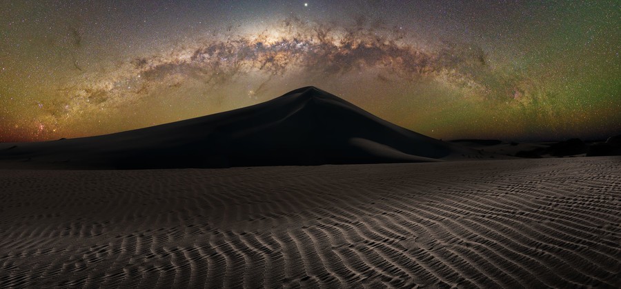 Milky Way arch over sand dune in Mungo National park in the Australian Outback