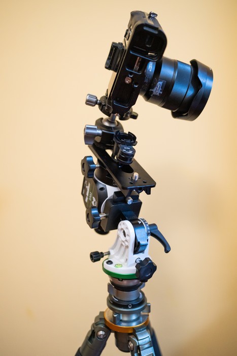 SkyWatcher Star Adventurer Mini setup with a tripod and a camera