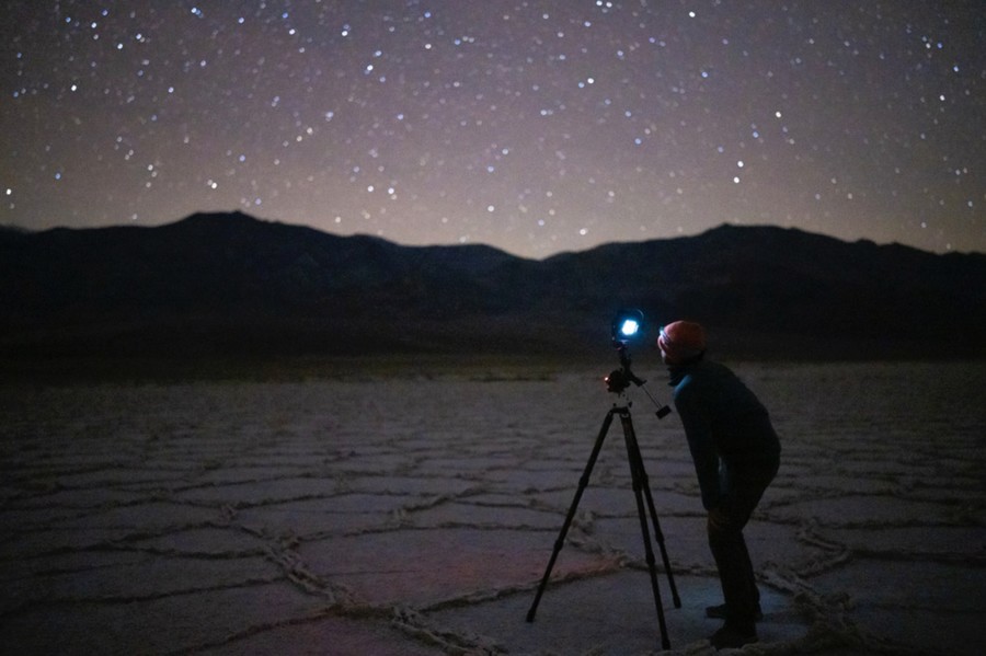 Astrophotographer taking photos if the nightsky