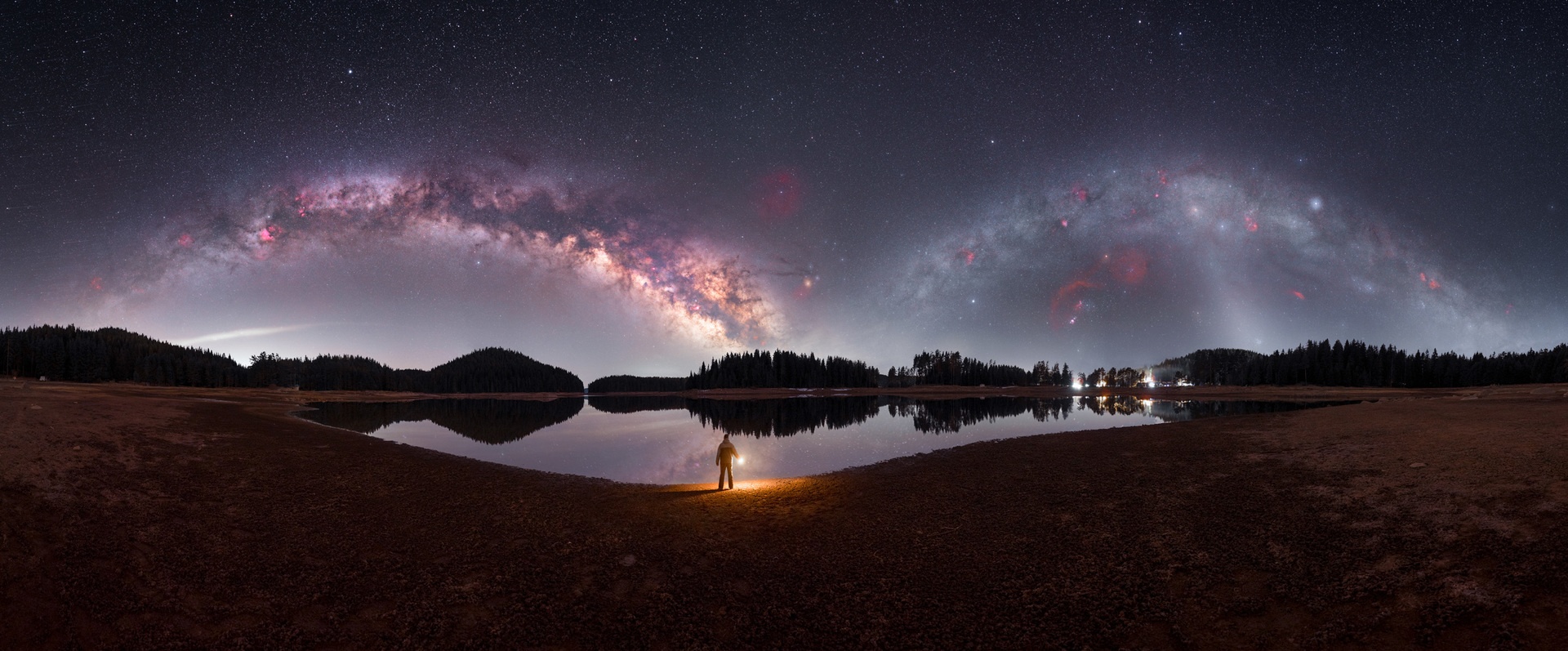 Panorama showing the summer Milky Way arc and winter Milky Way arc in a single image