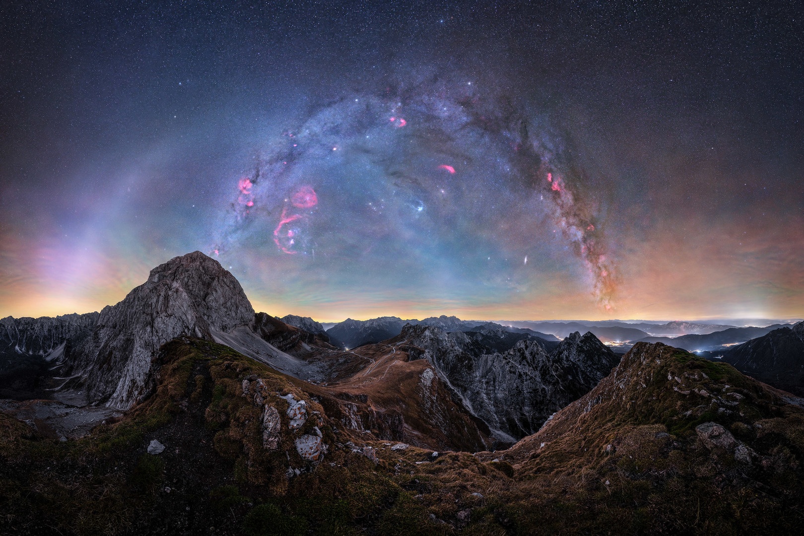 Winter Milky Way arc over the Julian Alps in Slovenia