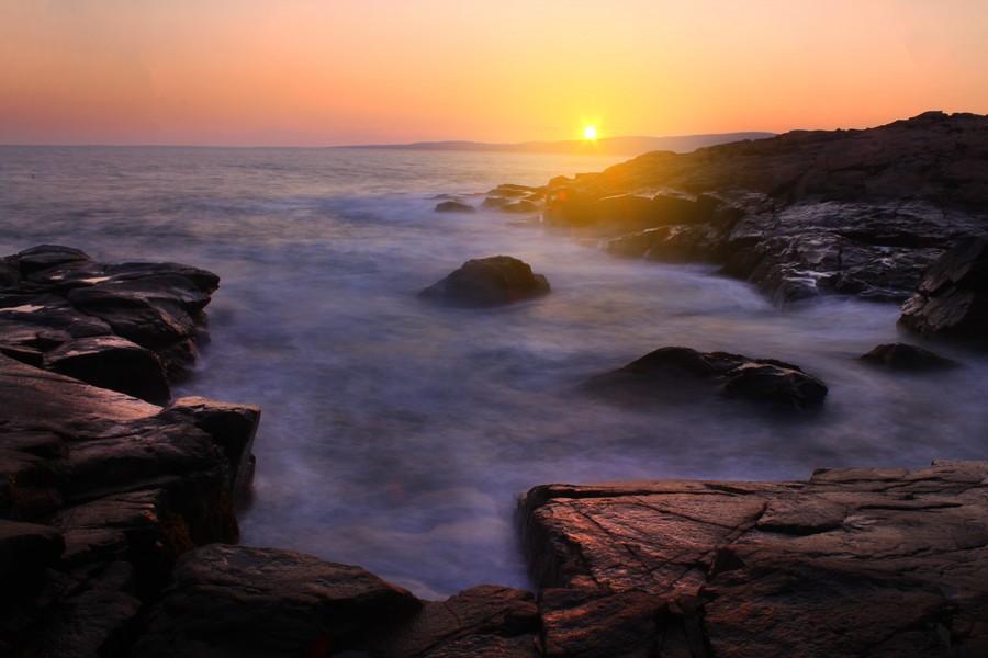 Sunset as seen from the shore in the Schoondic Peninsula in Acadia National Park