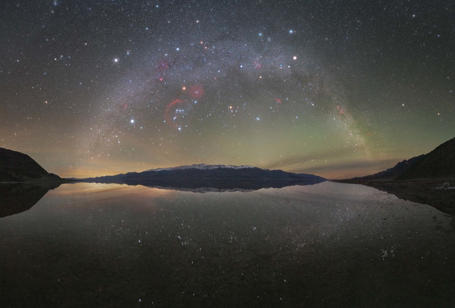 Winter Milky Way arc reflected over Badwater Basin
