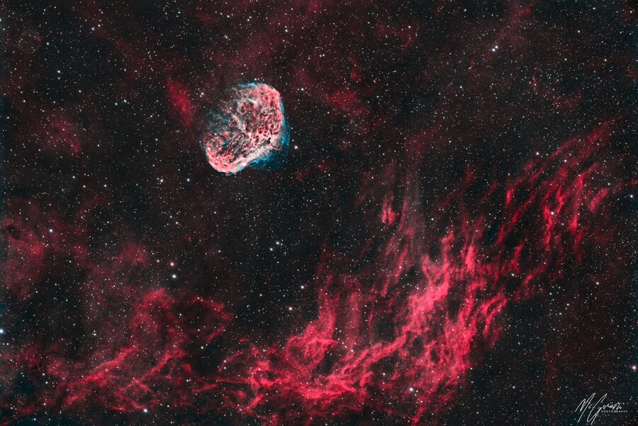 A colorful nebula, bright red and pink stars, deep space workshop