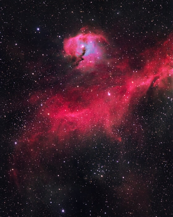 The image captures a colorful nebula in the vastness of space-space photography tour