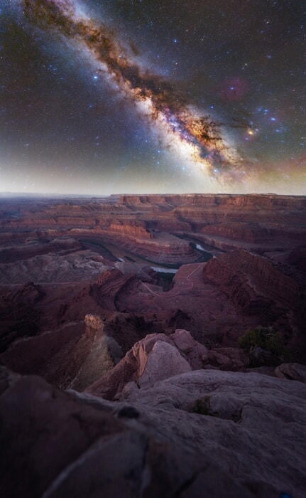 Milky Way illuminates the canyon below in this captivating night sky image