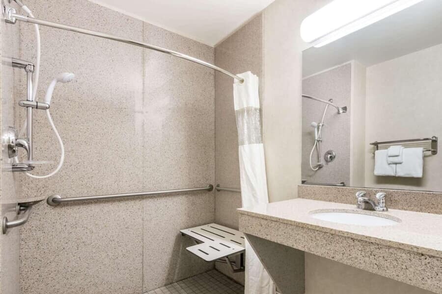 Hotel bathroom with shower and sink