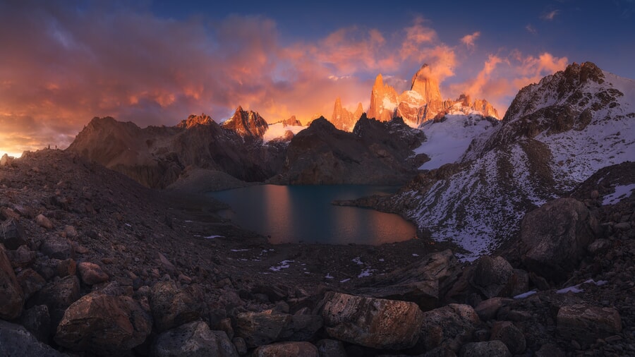 Argentinian Patagonia Lake surrounded by snowy mountains"