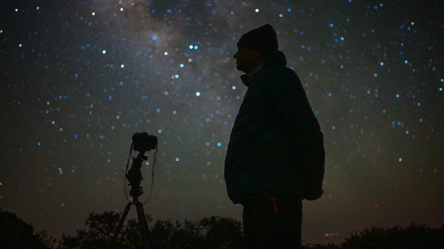 Man shadow in the darkness, starry sky