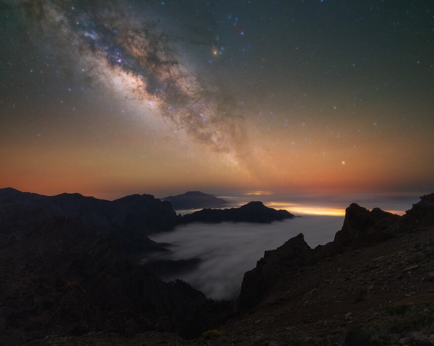 Clouds in the mountains and milky way in La Palma, Spain