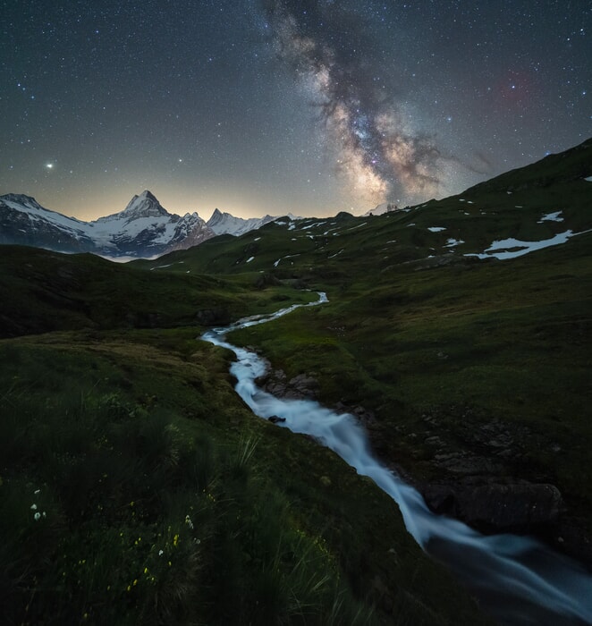 milky way above a river